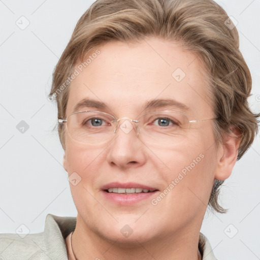 Joyful white adult female with short  brown hair and grey eyes