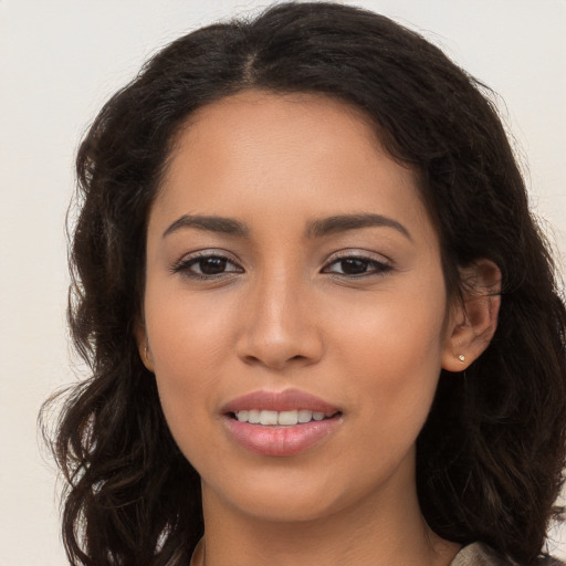 Joyful white young-adult female with long  brown hair and brown eyes