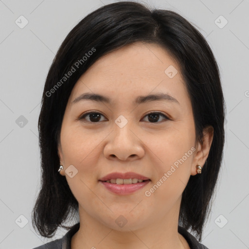 Joyful asian young-adult female with medium  brown hair and brown eyes