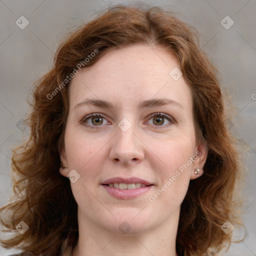 Joyful white young-adult female with medium  brown hair and green eyes