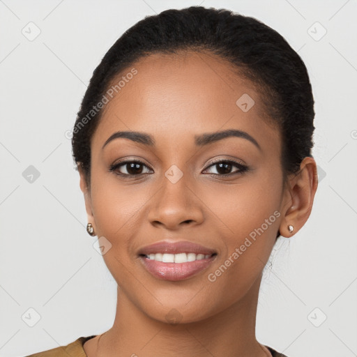 Joyful latino young-adult female with short  black hair and brown eyes