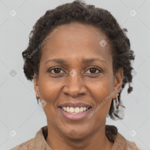 Joyful black adult female with short  brown hair and brown eyes