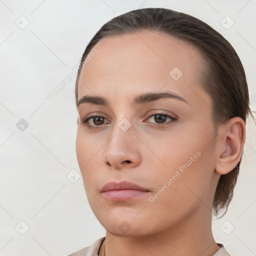 Neutral white young-adult female with medium  brown hair and brown eyes