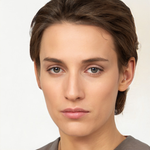 Neutral white young-adult female with short  brown hair and brown eyes