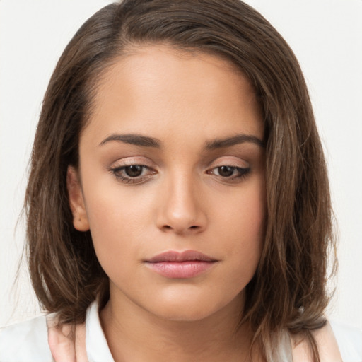 Neutral white young-adult female with long  brown hair and brown eyes