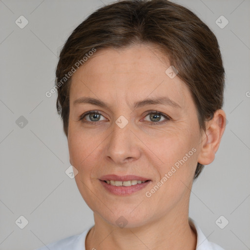 Joyful white adult female with short  brown hair and brown eyes