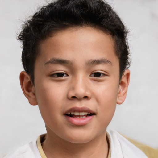 Joyful white child male with short  brown hair and brown eyes