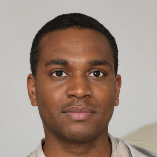 Neutral black young-adult male with short  black hair and brown eyes