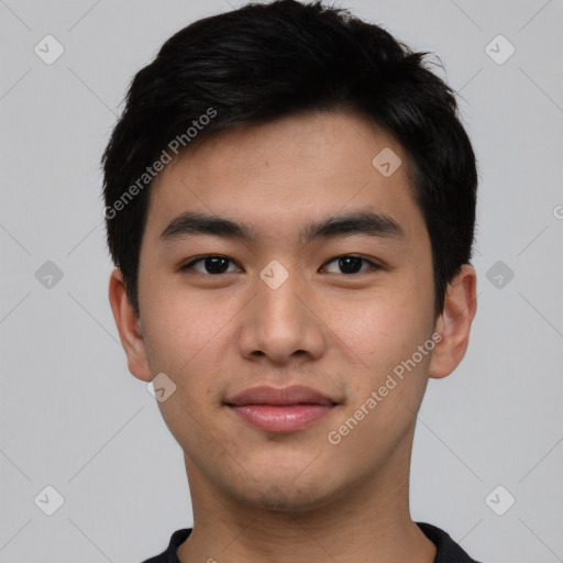 Joyful asian young-adult male with short  black hair and brown eyes