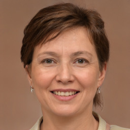 Joyful white adult female with medium  brown hair and brown eyes