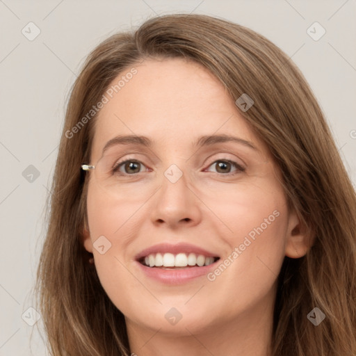 Joyful white young-adult female with long  brown hair and grey eyes