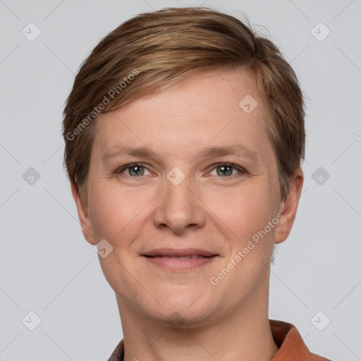 Joyful white adult female with short  brown hair and grey eyes