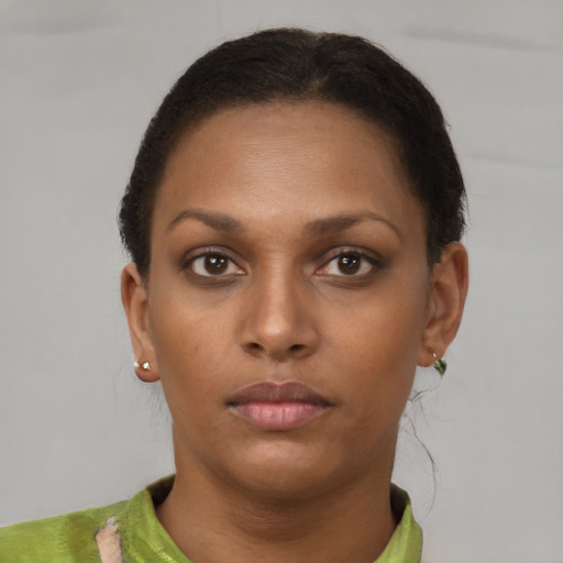 Neutral black young-adult female with short  brown hair and brown eyes