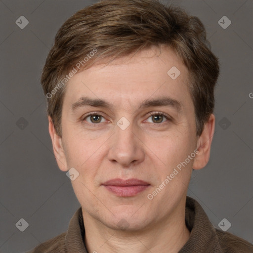 Joyful white adult male with short  brown hair and grey eyes