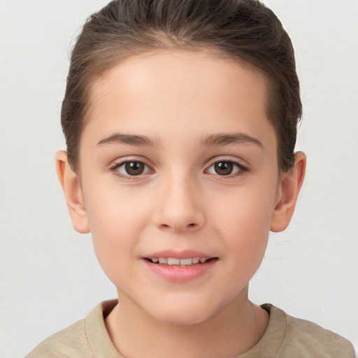 Joyful white child female with short  brown hair and brown eyes