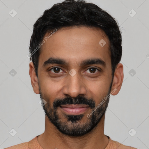 Joyful latino young-adult male with short  black hair and brown eyes