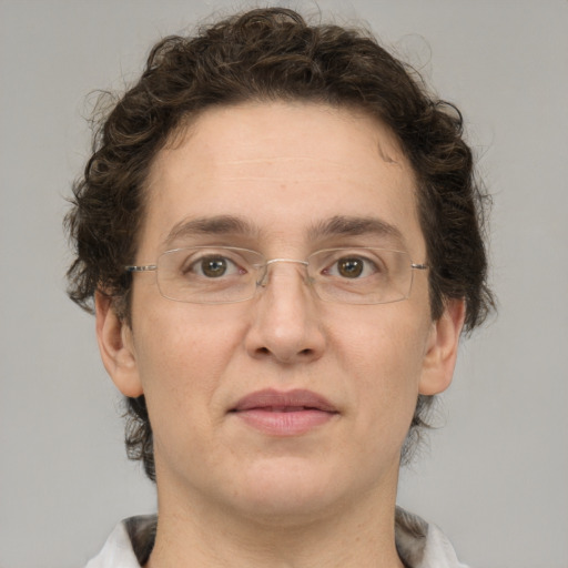 Joyful white adult male with medium  brown hair and grey eyes