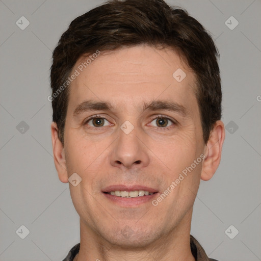 Joyful white young-adult male with short  brown hair and brown eyes