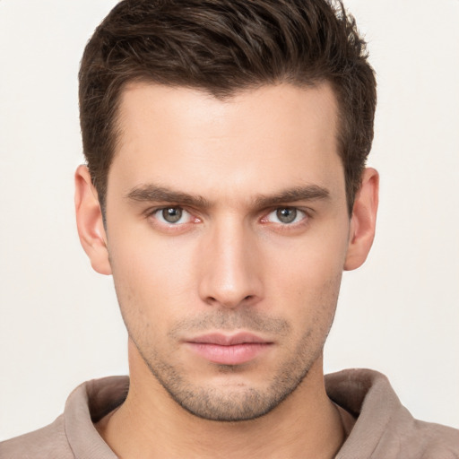 Neutral white young-adult male with short  brown hair and brown eyes