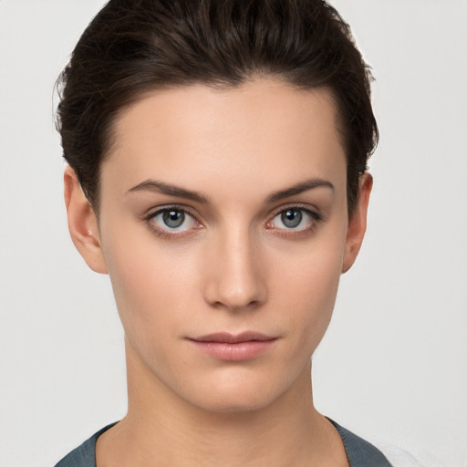 Neutral white young-adult female with short  brown hair and brown eyes