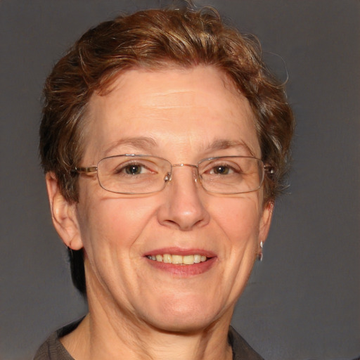 Joyful white middle-aged female with short  brown hair and blue eyes