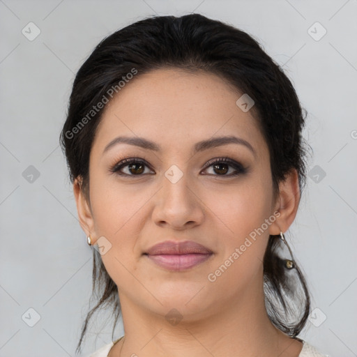 Joyful latino young-adult female with medium  brown hair and brown eyes