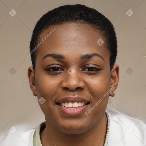 Joyful black young-adult female with short  black hair and brown eyes