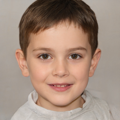 Joyful white child male with short  brown hair and brown eyes