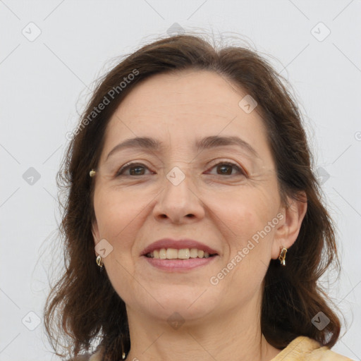 Joyful white adult female with medium  brown hair and brown eyes