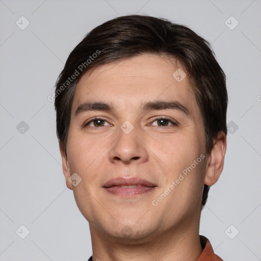 Joyful white young-adult male with short  brown hair and brown eyes