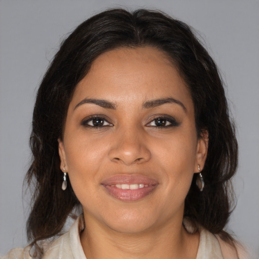 Joyful black young-adult female with medium  brown hair and brown eyes
