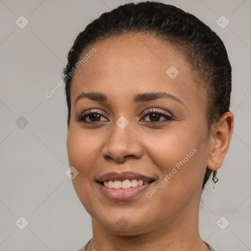 Joyful latino young-adult female with short  brown hair and brown eyes