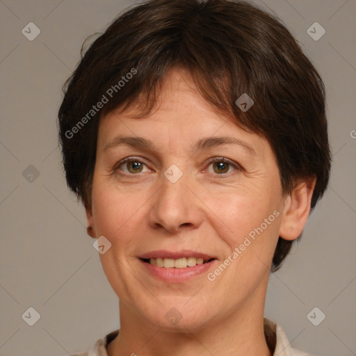 Joyful white adult female with medium  brown hair and grey eyes