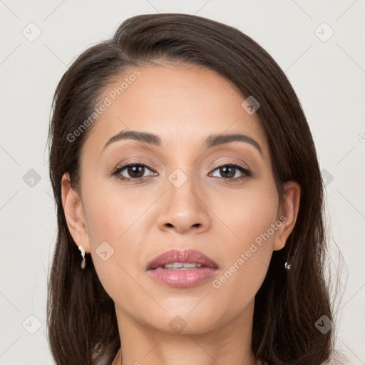 Joyful white young-adult female with long  brown hair and brown eyes