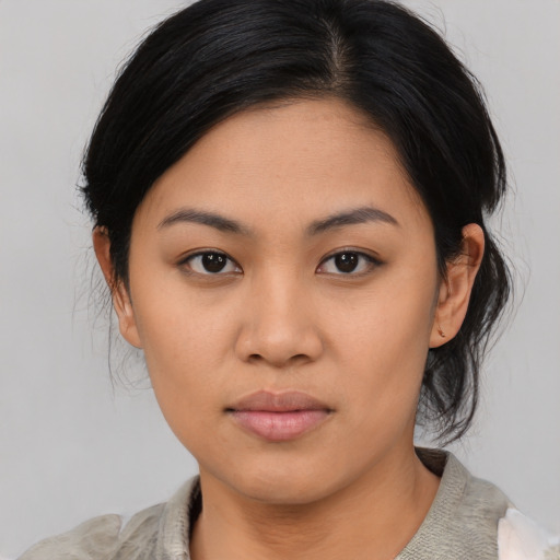 Neutral asian young-adult female with medium  black hair and brown eyes