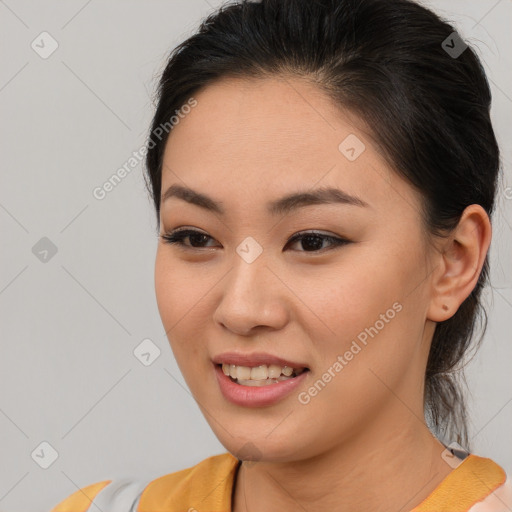 Joyful asian young-adult female with medium  brown hair and brown eyes