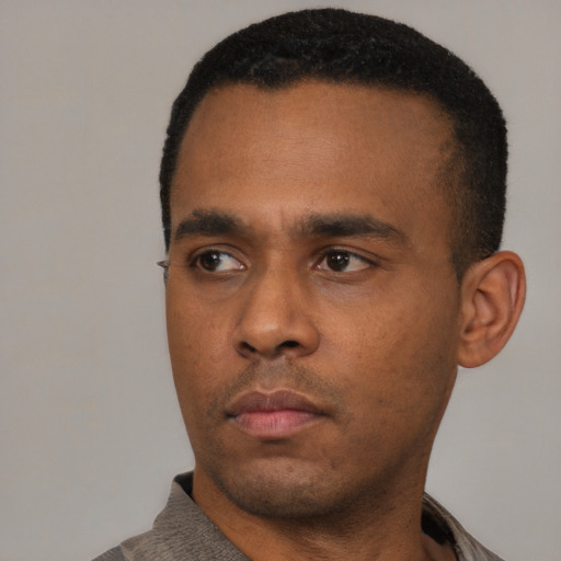 Neutral black young-adult male with short  black hair and brown eyes