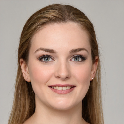 Joyful white young-adult female with long  brown hair and grey eyes