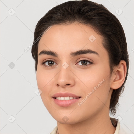 Joyful white young-adult female with long  brown hair and brown eyes