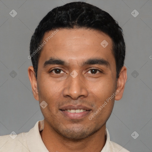 Joyful latino young-adult male with short  black hair and brown eyes