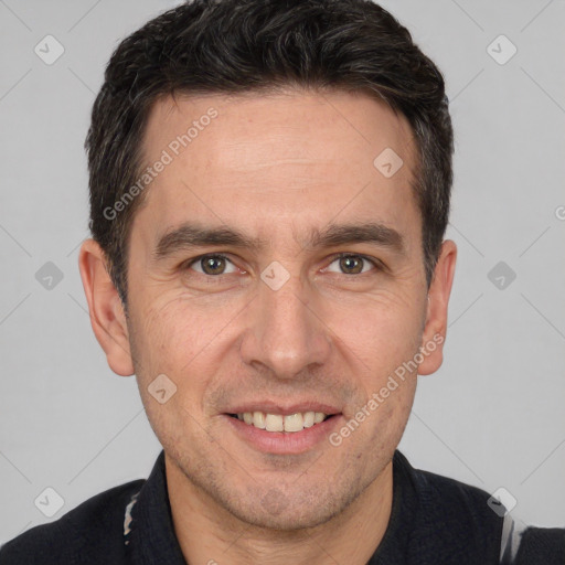 Joyful white adult male with short  brown hair and brown eyes