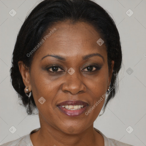 Joyful black adult female with medium  brown hair and brown eyes