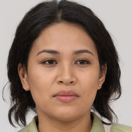 Joyful asian young-adult female with medium  brown hair and brown eyes