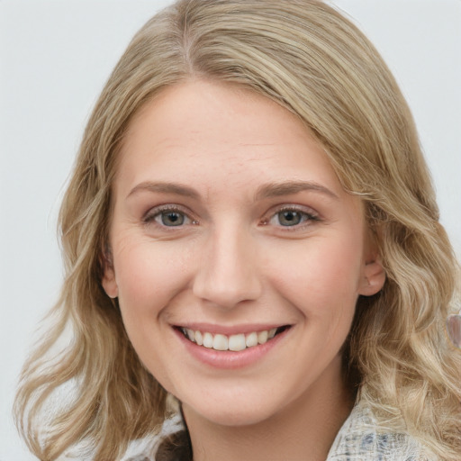 Joyful white young-adult female with medium  brown hair and blue eyes