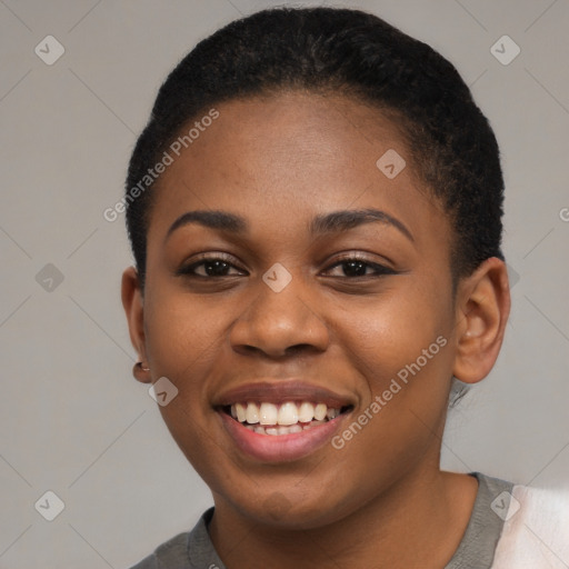 Joyful black young-adult female with short  brown hair and brown eyes