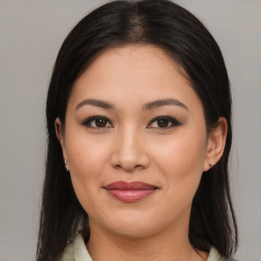 Joyful asian young-adult female with medium  brown hair and brown eyes