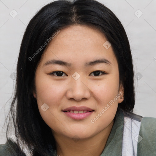 Joyful asian young-adult female with long  brown hair and brown eyes