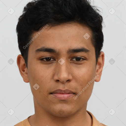 Neutral latino young-adult male with short  brown hair and brown eyes