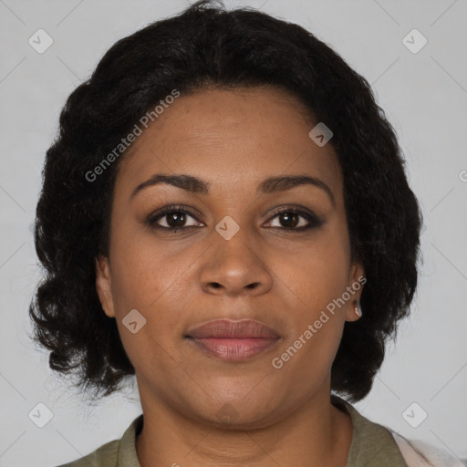 Joyful black adult female with medium  brown hair and brown eyes