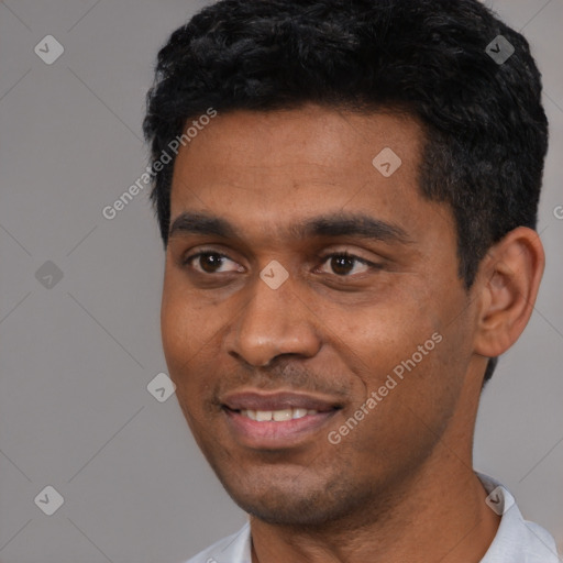 Joyful black young-adult male with short  black hair and brown eyes